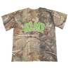 Knocked Loose's "Cross Overlay KLMF" design, printed on the front and upper back of a Real Tree Camo Tee.