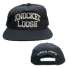 Knocked Loose's "Varsity Arch" design embroidered on the front and back of a navy Yupoong Snapback.