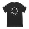 Turnstile's "Never Enough Daniel" design, printed on the front, back and both sleeves of a black tee with a custom woven tag.